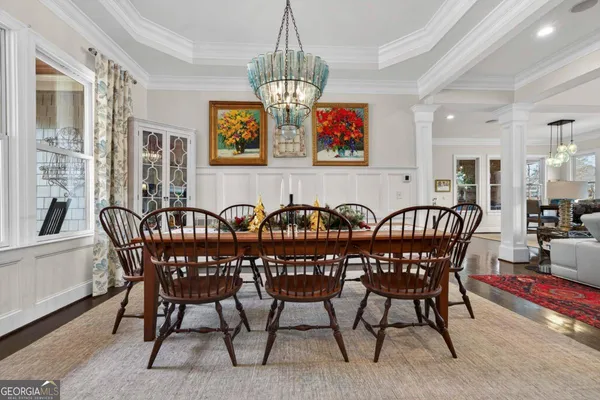 a kitchen with stainless steel appliances granite countertop a stove top oven a sink and a refrigerator