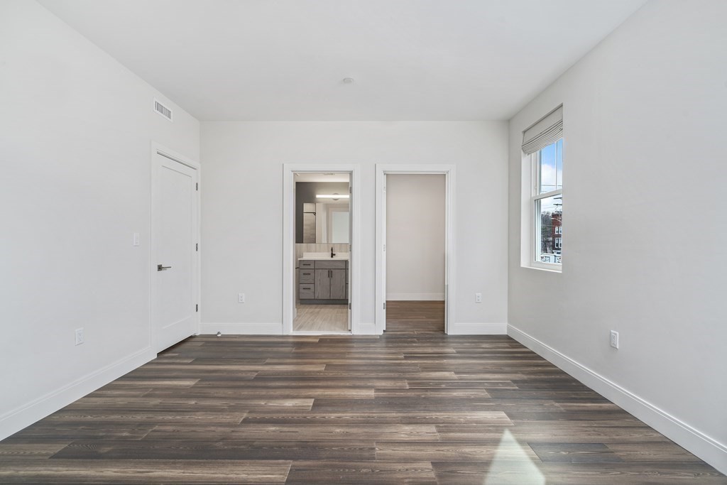 429 Cherry Street, Unit 12 Newton, MA 02465 - Photo 14 of 20 a view of empty room with wooden floor