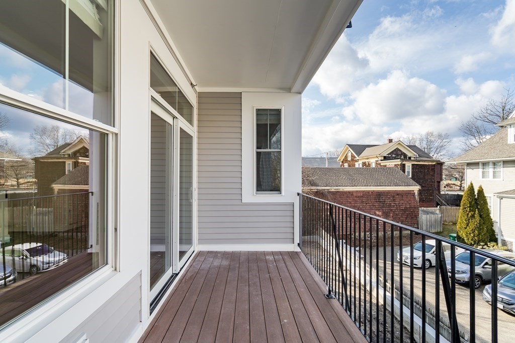 429 Cherry Street, Unit 12 Newton, MA 02465 - Photo 16 of 20 a view of balcony with wooden floor