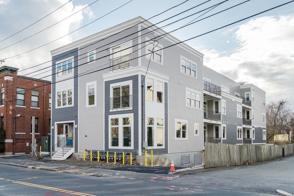 429 Cherry Street, Unit 12 Newton, MA 02465 - Photo 19 of 20 a front view of a building with a street