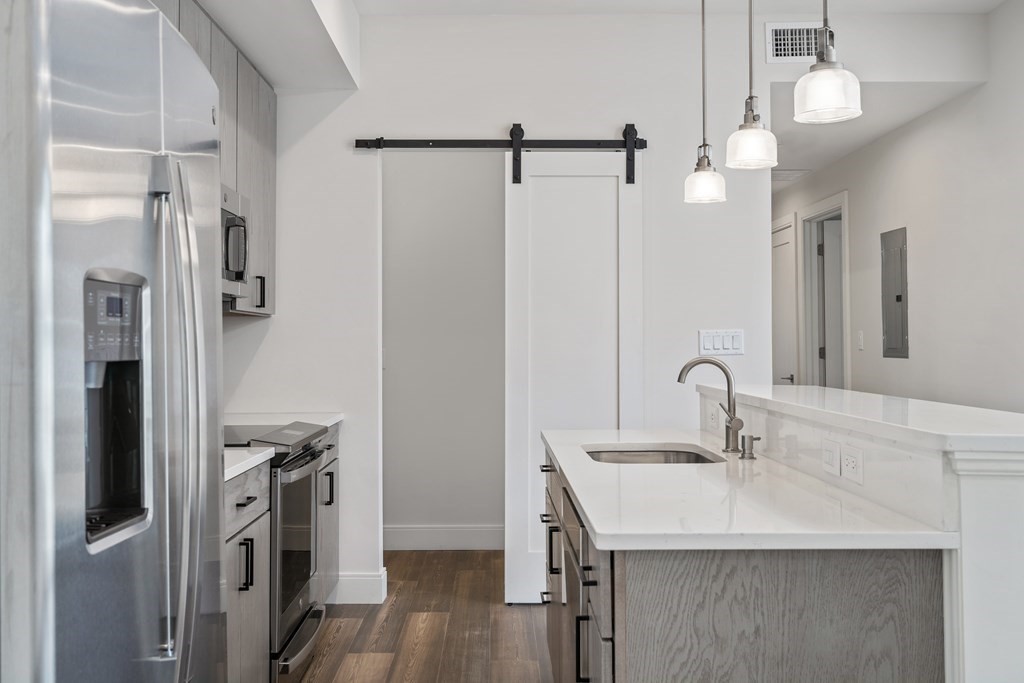 429 Cherry Street, Unit 12 Newton, MA 02465 - Photo 8 of 20 a bathroom with a sink a mirror and shower