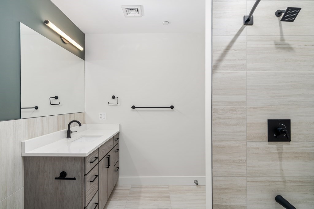429 Cherry Street, Unit 12 Newton, MA 02465 - Photo 10 of 20 a bathroom with a sink and a mirror