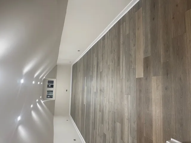 a view of a hallway with stairs