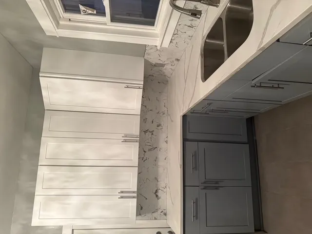 a view of walk in closet with racks on the wall