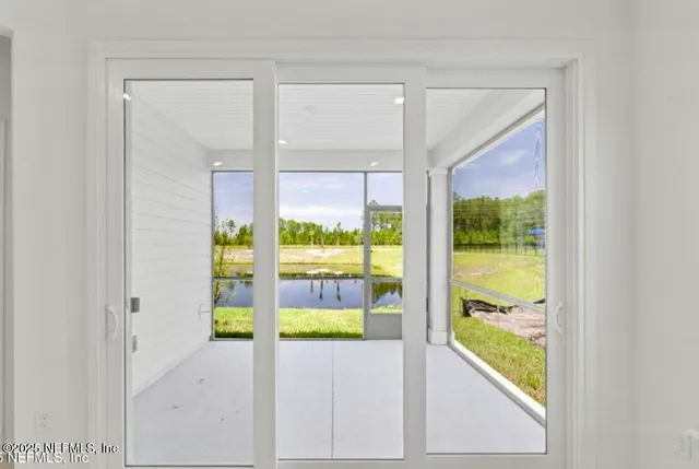 a view of an empty room and window