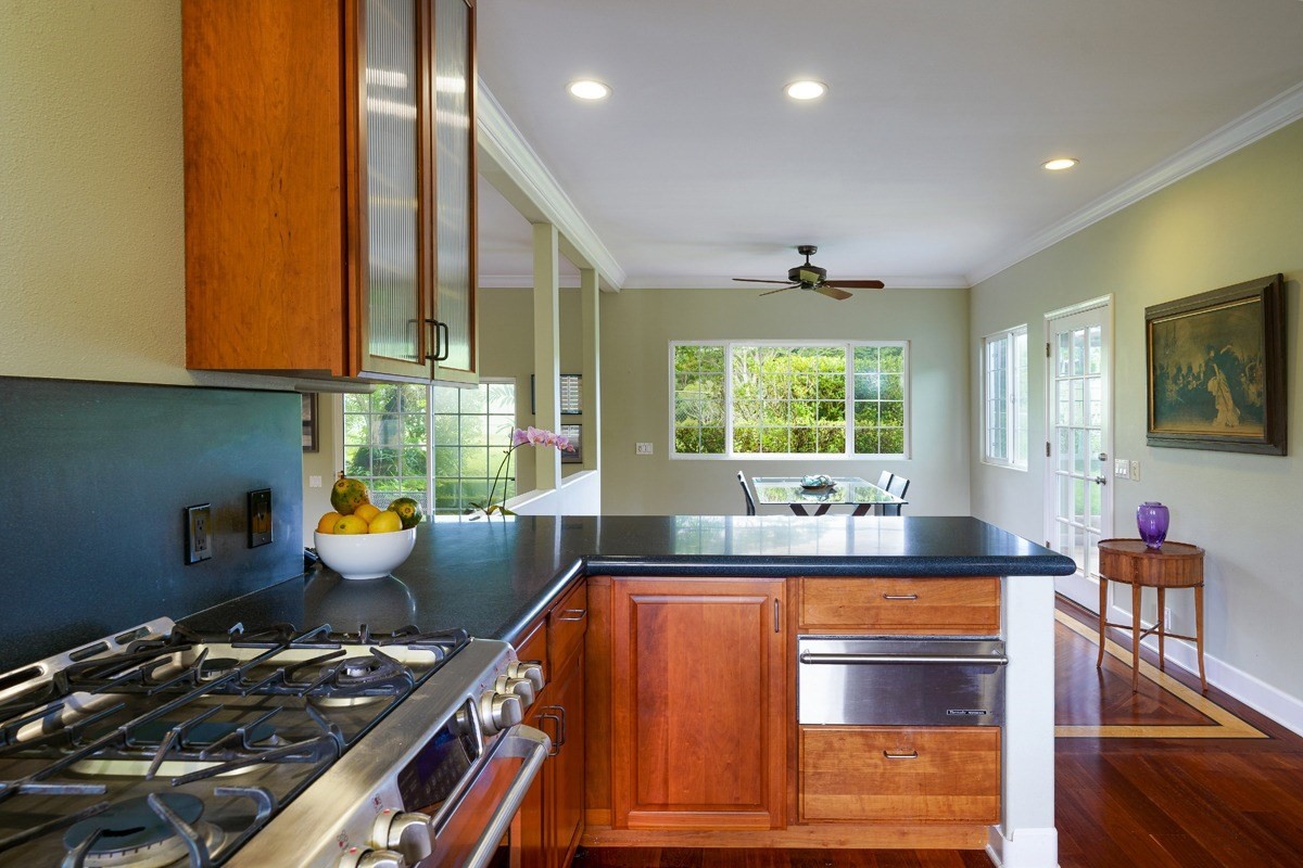 6420 Puupilo Road, Unit A Kapaa, HI 96746 - Photo 9 of 22 a kitchen with stainless steel appliances granite countertop a stove and a sink