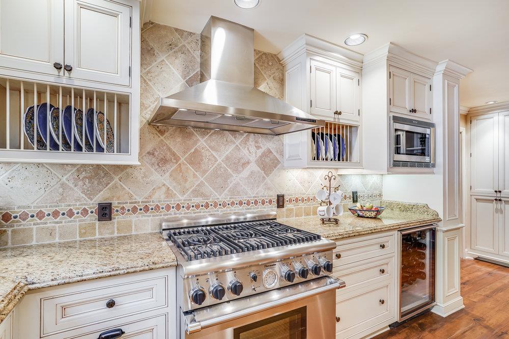 475 Rincon Avenue Sunnyvale, CA 94086 - Photo 23 of 58 a kitchen with stainless steel appliances granite countertop a stove and a sink