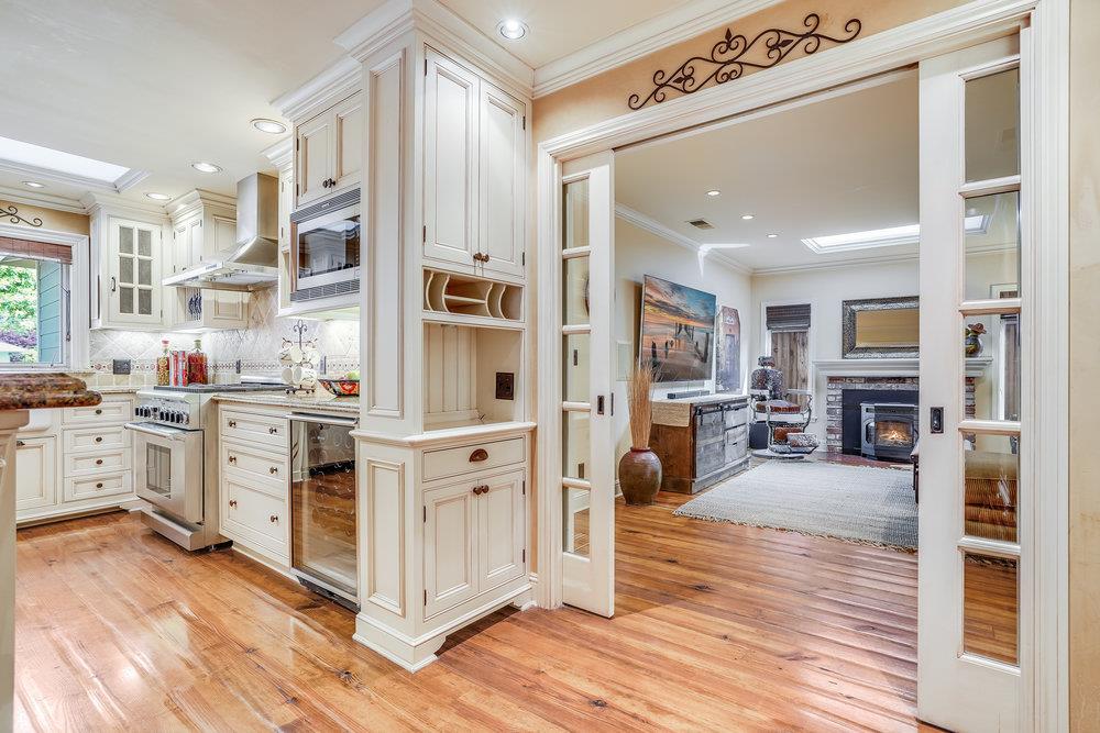 475 Rincon Avenue Sunnyvale, CA 94086 - Photo 24 of 58 a kitchen with cabinets and wooden floor