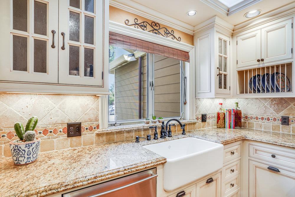 475 Rincon Avenue Sunnyvale, CA 94086 - Photo 26 of 58 a kitchen with stainless steel appliances granite countertop a sink and cabinets