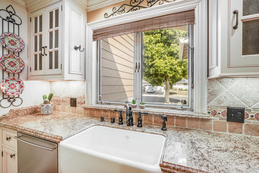 475 Rincon Avenue Sunnyvale, CA 94086 - Photo 27 of 58 a bathroom with granite countertop a sink and a window