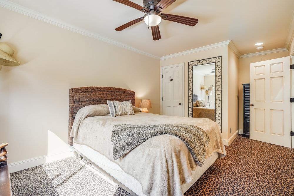 475 Rincon Avenue Sunnyvale, CA 94086 - Photo 29 of 58 a bedroom with a bed and ceiling fan