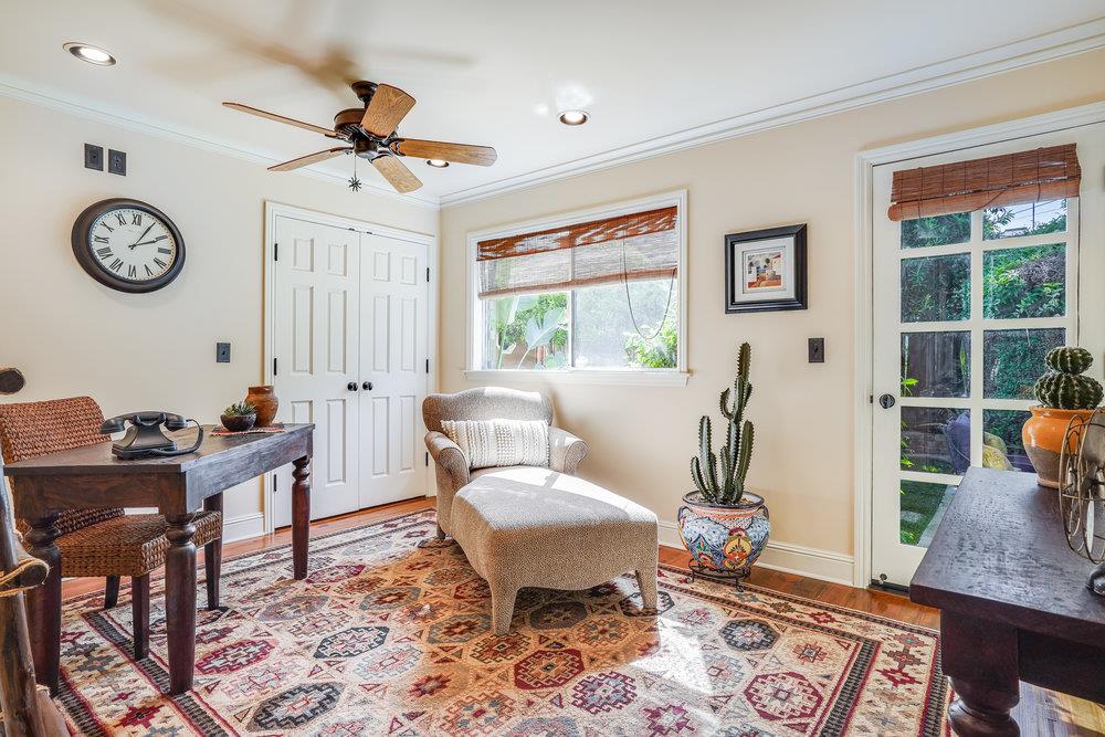 475 Rincon Avenue Sunnyvale, CA 94086 - Photo 30 of 58 a living room with furniture a clock on wall and a window