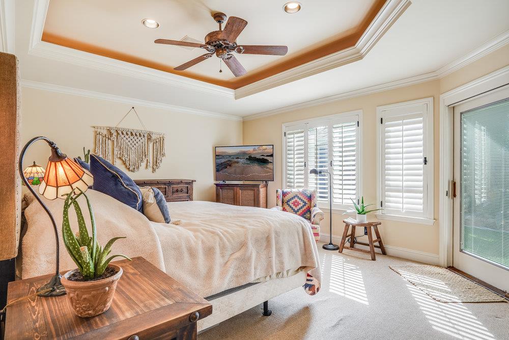 475 Rincon Avenue Sunnyvale, CA 94086 - Photo 33 of 58 a bedroom with a bed a chandelier and dresser