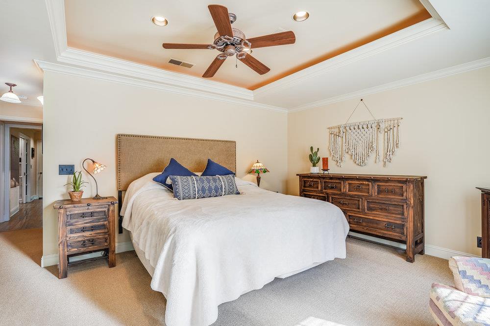 475 Rincon Avenue Sunnyvale, CA 94086 - Photo 34 of 58 a bedroom with a bed and ceiling fan