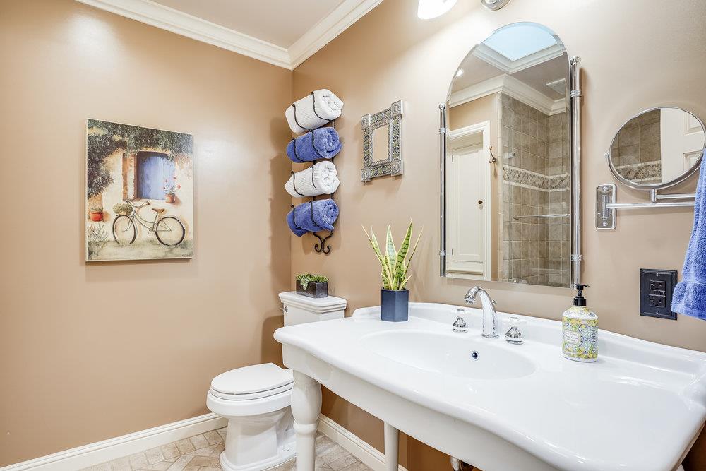 475 Rincon Avenue Sunnyvale, CA 94086 - Photo 35 of 58 a bathroom with a toilet a sink and a mirror