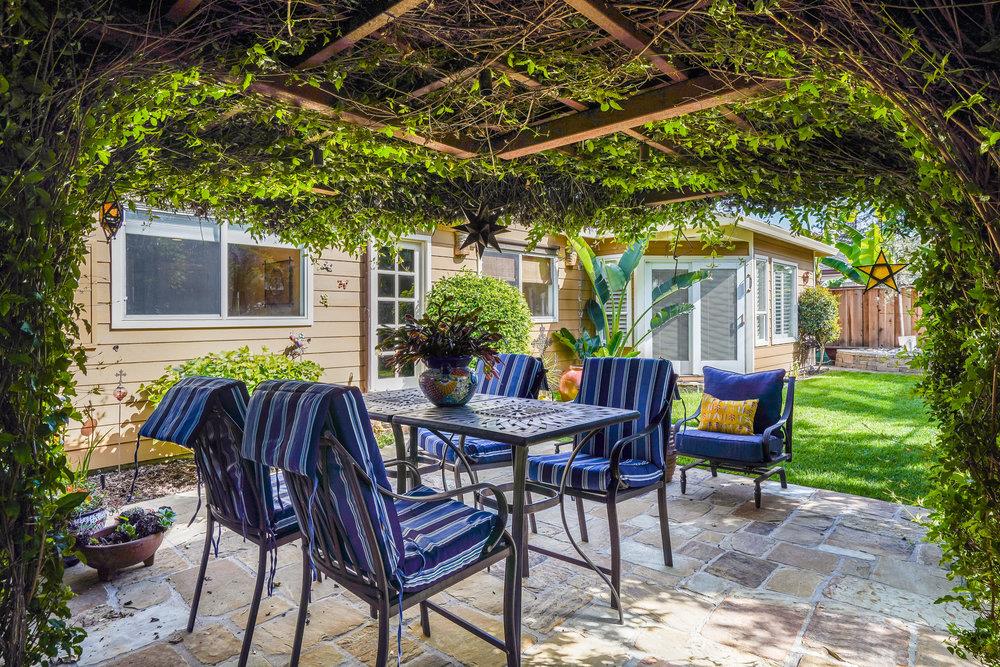475 Rincon Avenue Sunnyvale, CA 94086 - Photo 50 of 58 a view of a chairs and table in backyard of the house