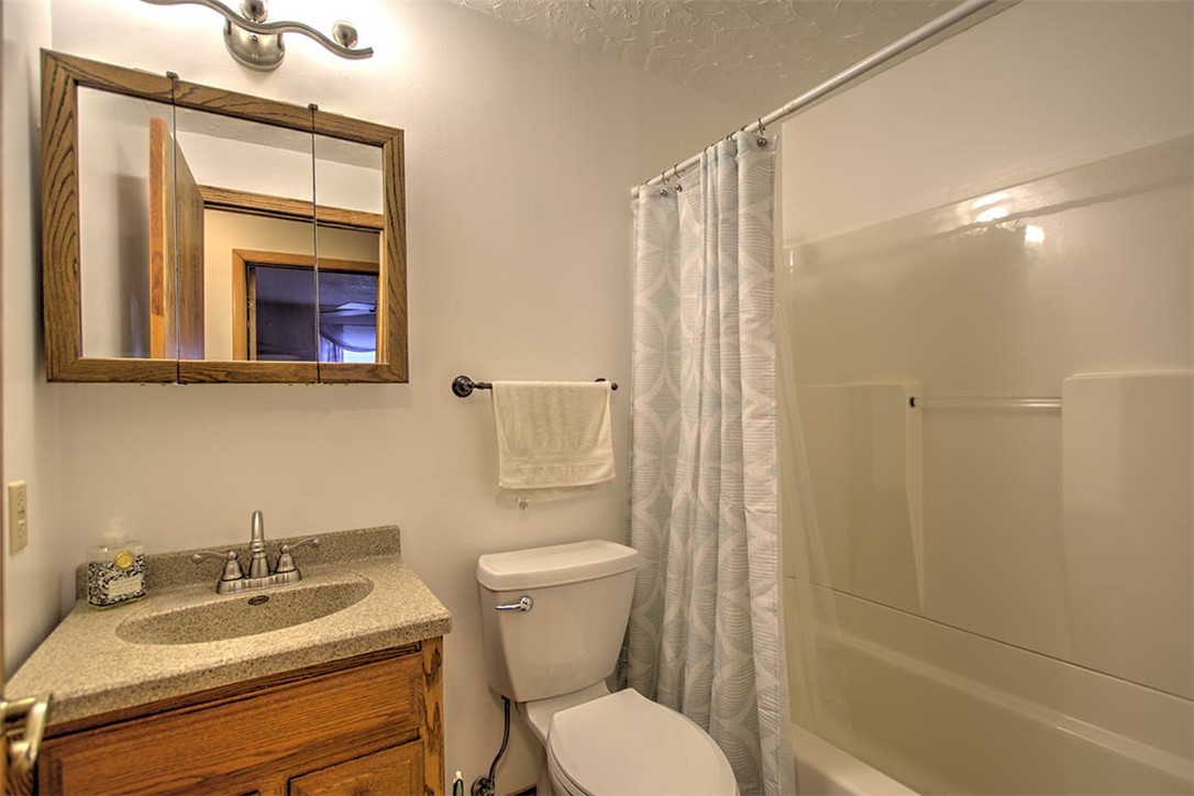 2913 South Danny Drive Decatur, IL 62521 - Photo 21 of 31 a bathroom with a granite countertop sink toilet and shower