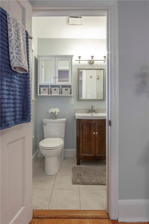 4143 Pineview Road Charlotte, NC 28211 - Photo 11 of 22 a bathroom with a toilet a sink and mirror