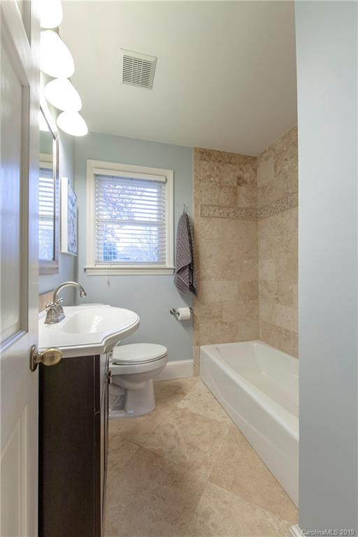 4143 Pineview Road Charlotte, NC 28211 - Photo 14 of 22 a bathroom with a sink a toilet and bathtub