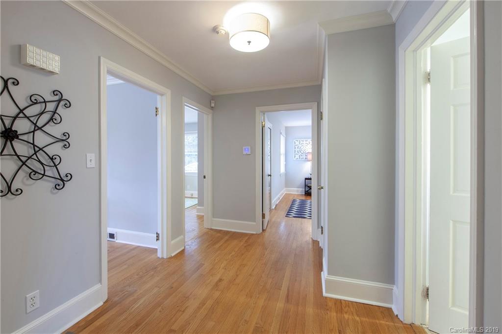 4143 Pineview Road Charlotte, NC 28211 - Photo 15 of 22 a view of a hallway with wooden floor