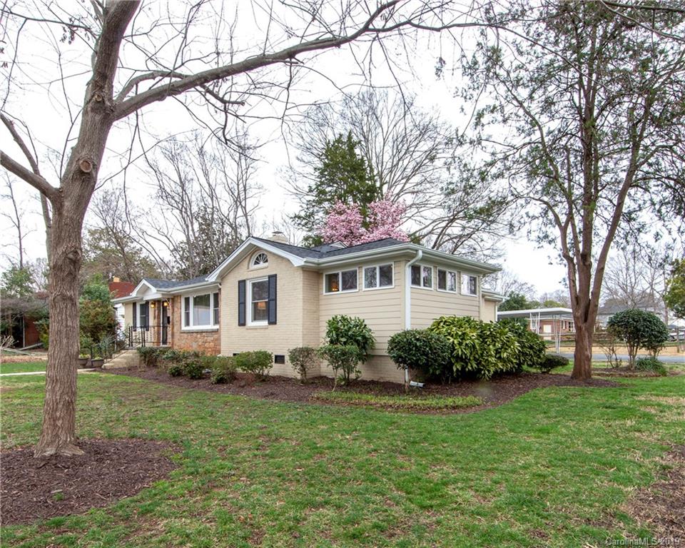 4143 Pineview Road Charlotte, NC 28211 - Photo 22 of 22 a front view of a house with a garden