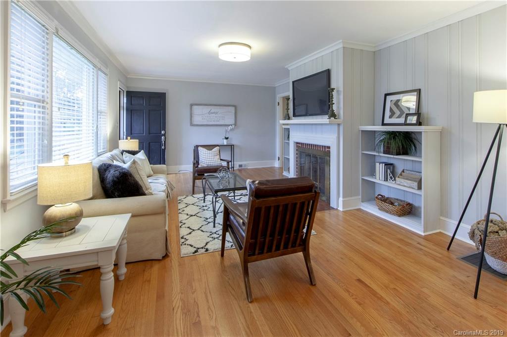 4143 Pineview Road Charlotte, NC 28211 - Photo 4 of 22 a living room with furniture and a fireplace