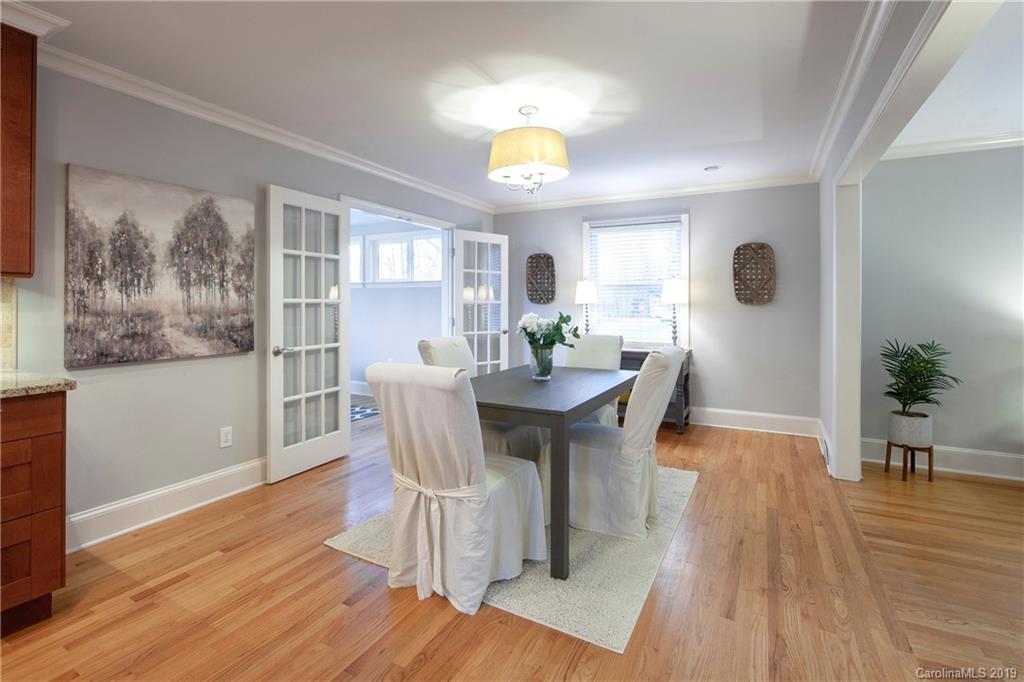 4143 Pineview Road Charlotte, NC 28211 - Photo 7 of 22 a view of a dining room with furniture and wooden floor