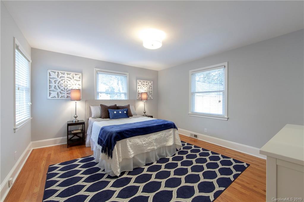 4143 Pineview Road Charlotte, NC 28211 - Photo 9 of 22 a bedroom with double bed and a window