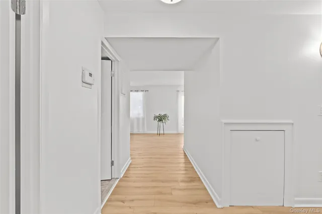 a room with pool table and windows