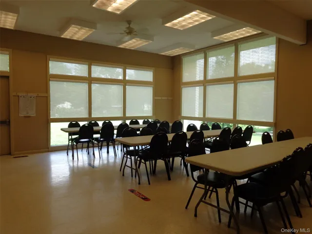 a bathroom with a sink and a wall painting