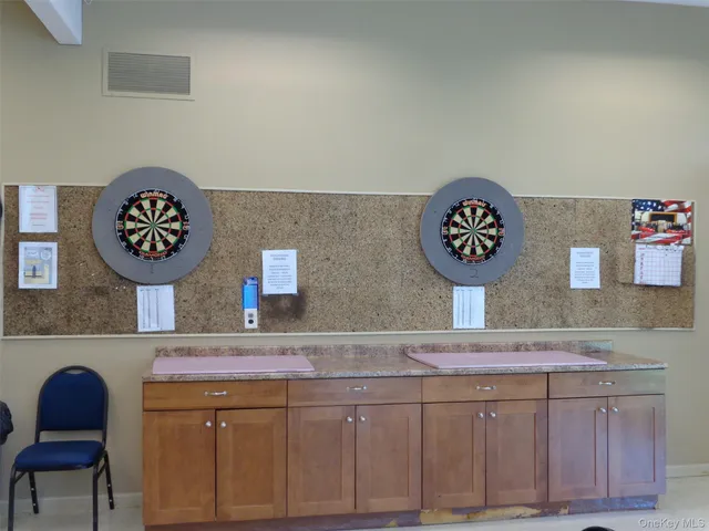 a workspace room with a table and chairs