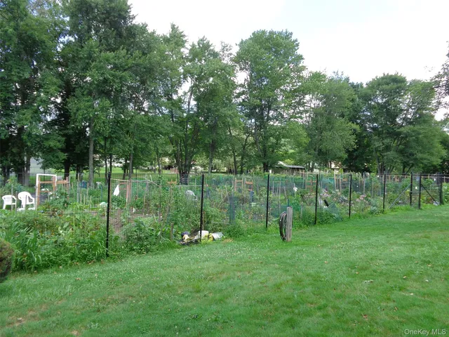 a view of a swimming pool with sitting area