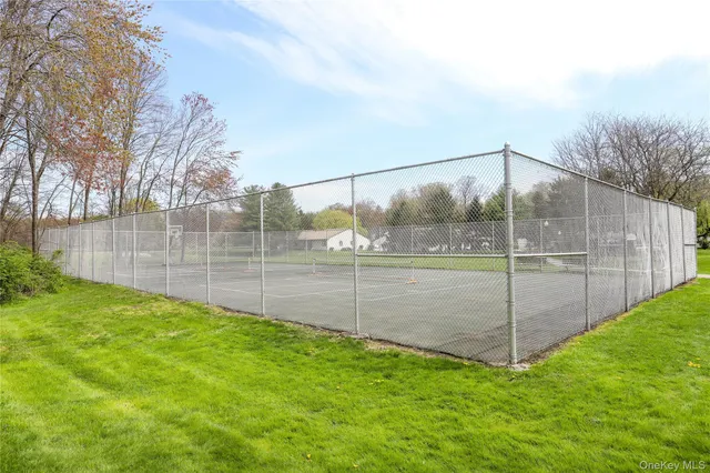 a view of a house with a wooden deck