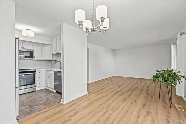 a kitchen with stainless steel appliances granite countertop a stove and a sink