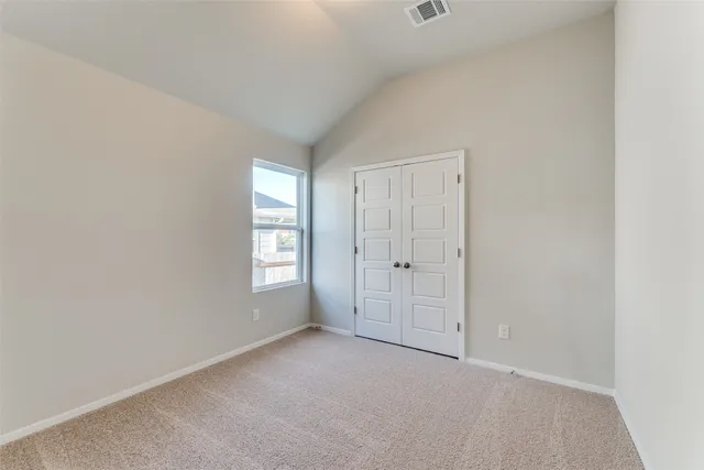 a view of empty room with windows