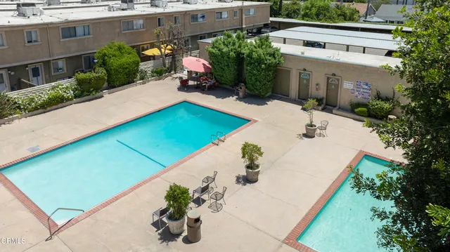 a view of a backyard with plants and a patio