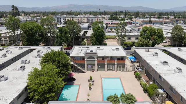 an aerial view of a house with a garden and plants