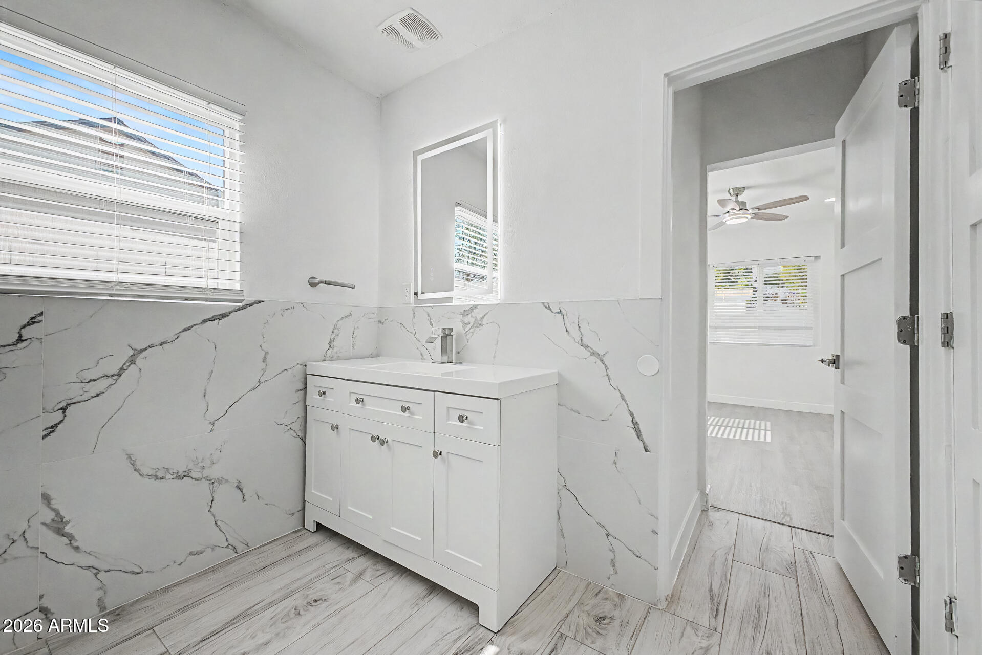 532 East Cheery Lynn Road Phoenix, AZ 85014 - Photo 19 of 37 a spacious bathroom with a double vanity sink a mirror and a shower