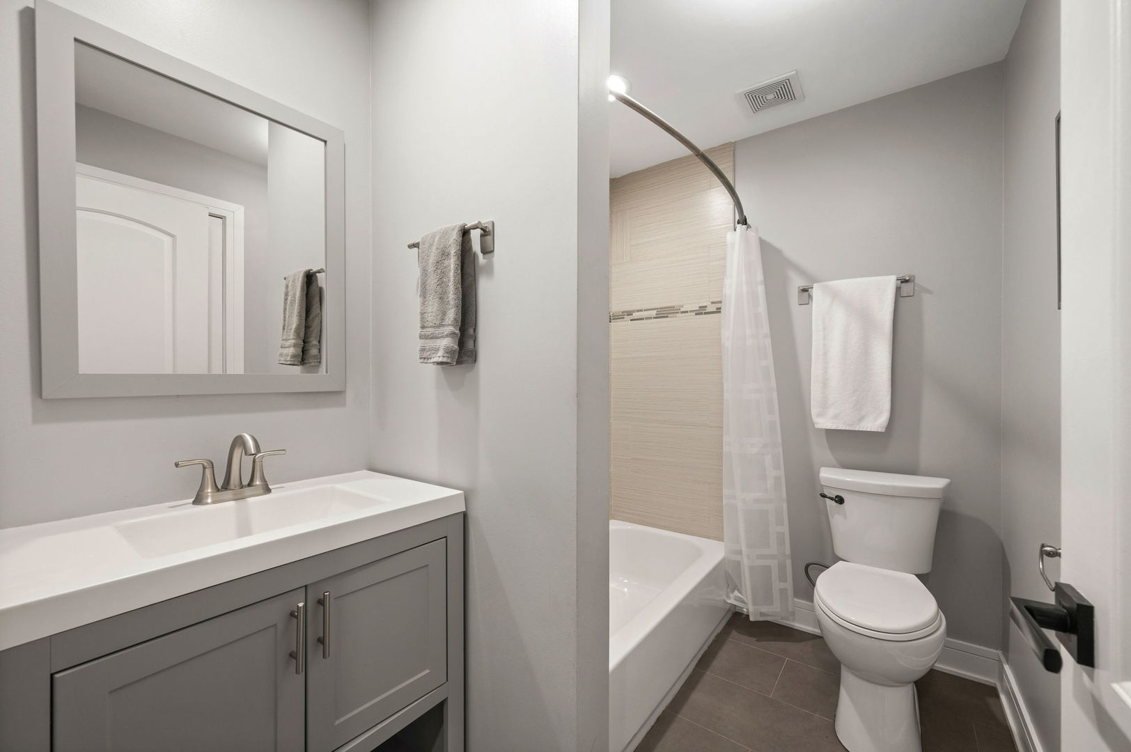 3343 West Potomac Avenue Chicago, IL 60651 - Photo 14 of 44 a bathroom with a toilet sink and shower