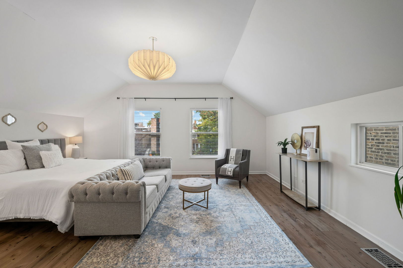 3343 West Potomac Avenue Chicago, IL 60651 - Photo 17 of 44 a bedroom with a bed and wooden floor