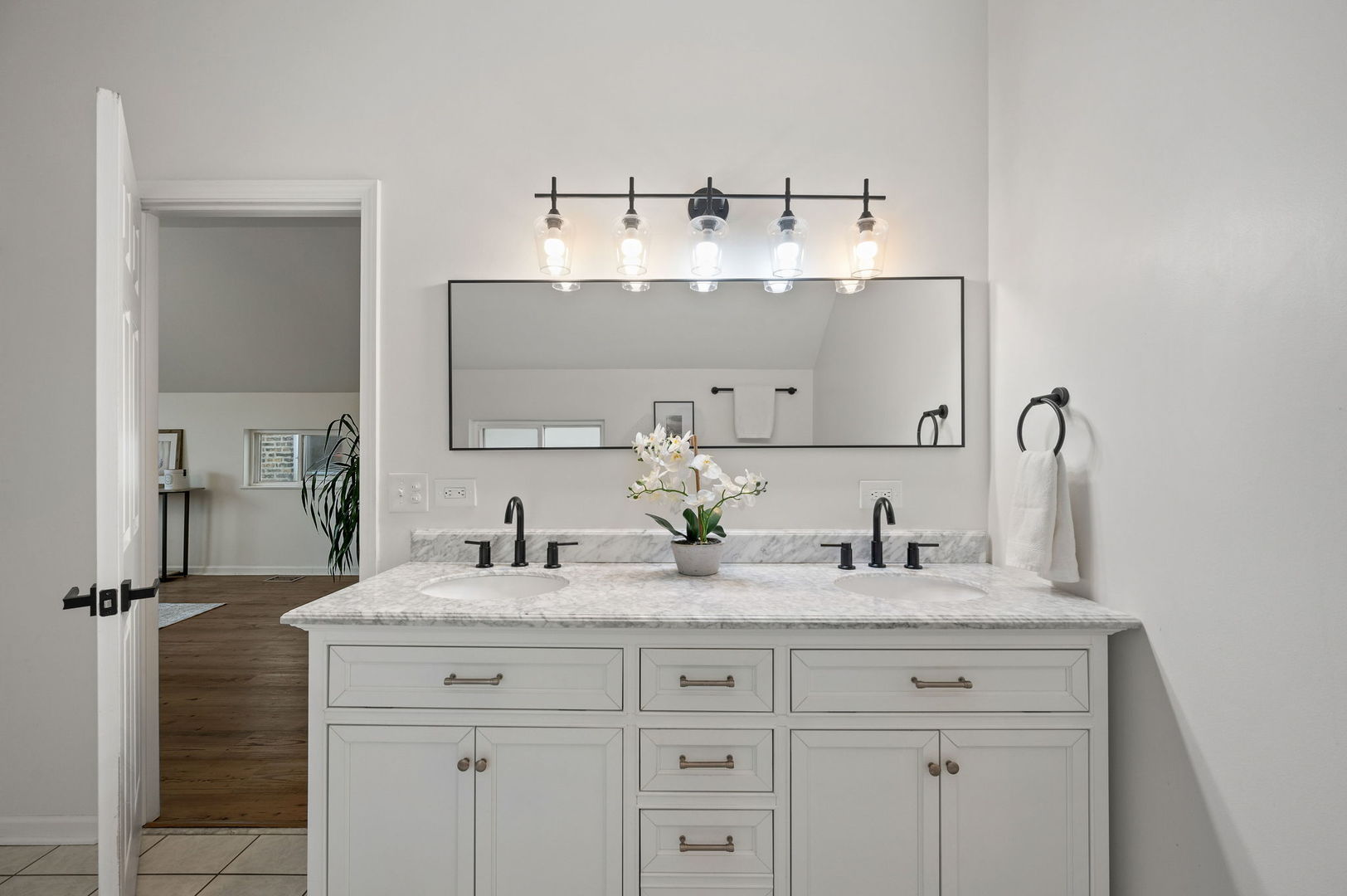 3343 West Potomac Avenue Chicago, IL 60651 - Photo 22 of 44 a bathroom with a sink and a mirror