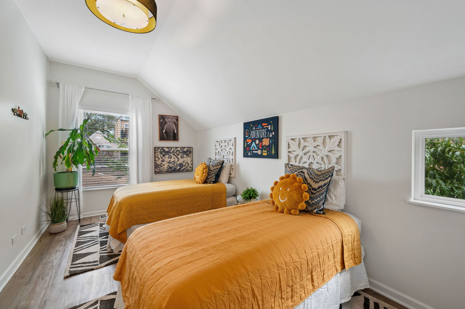 3343 West Potomac Avenue Chicago, IL 60651 - Photo 26 of 44 a bedroom with a bed and a potted plant