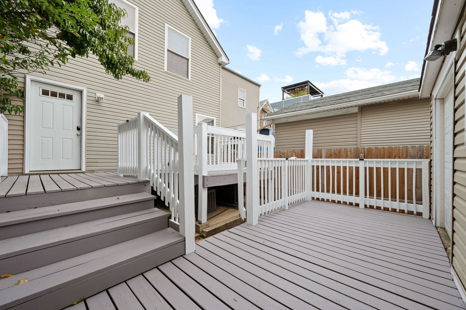 3343 West Potomac Avenue Chicago, IL 60651 - Photo 35 of 44 a view of a house with wooden deck