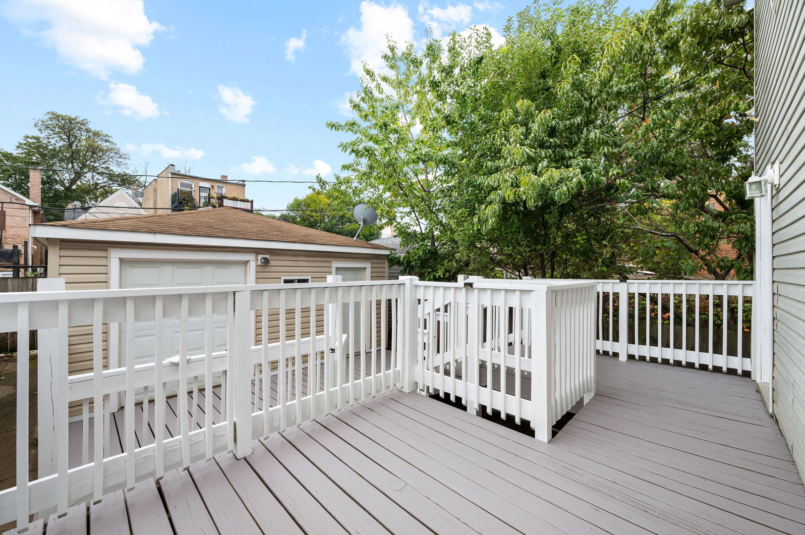3343 West Potomac Avenue Chicago, IL 60651 - Photo 36 of 44 a view of a wooden deck with a yard