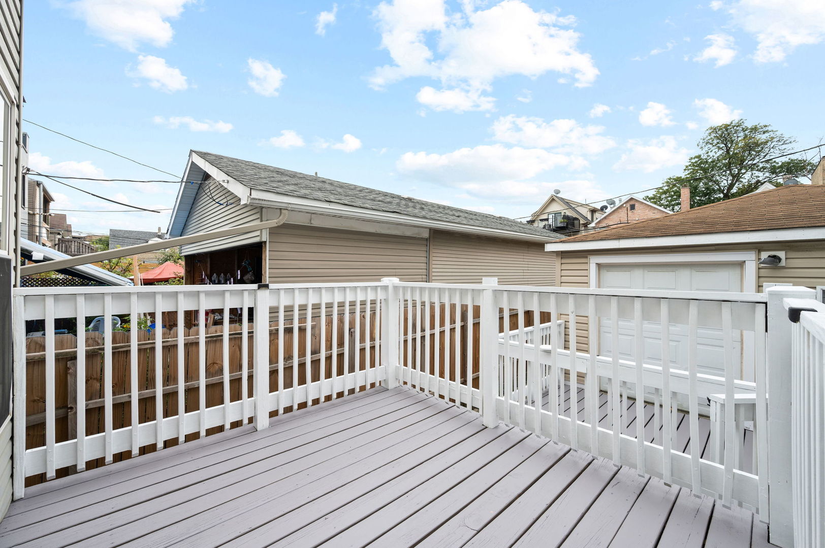 3343 West Potomac Avenue Chicago, IL 60651 - Photo 37 of 44 a view of a balcony with wooden floor