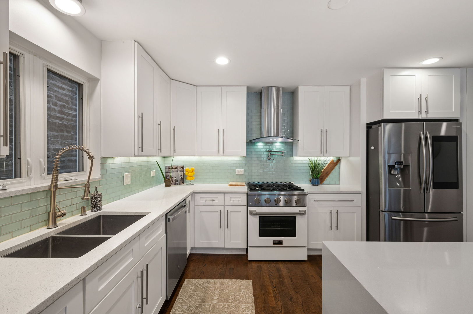 3343 West Potomac Avenue Chicago, IL 60651 - Photo 10 of 44 a kitchen with a stove a sink and a refrigerator
