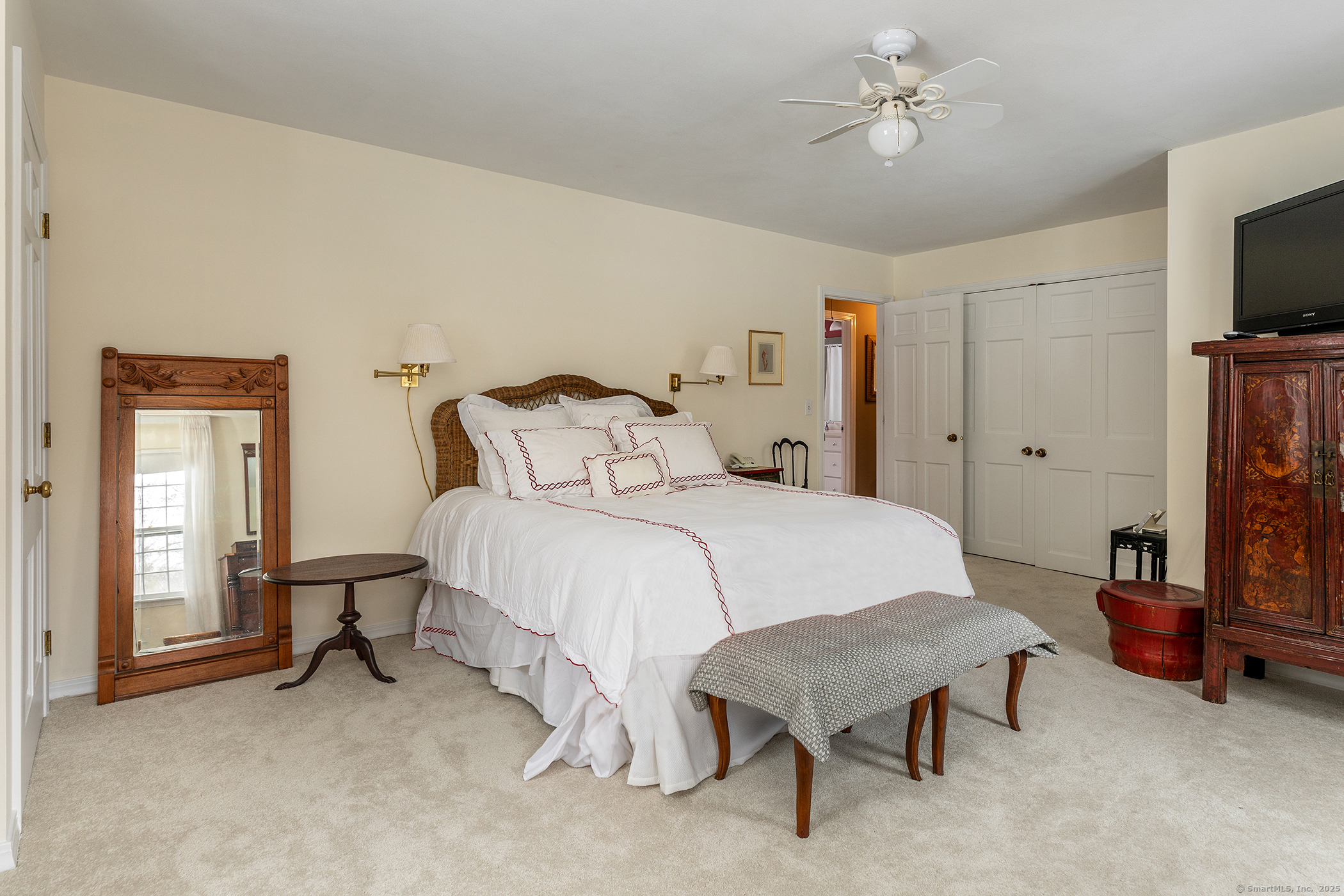 5 North Street Roxbury, CT 06783 - Photo 18 of 28 a bedroom with a bed and a flat screen tv