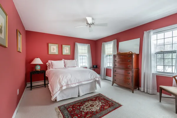 a bed room with a bed and a chandelier