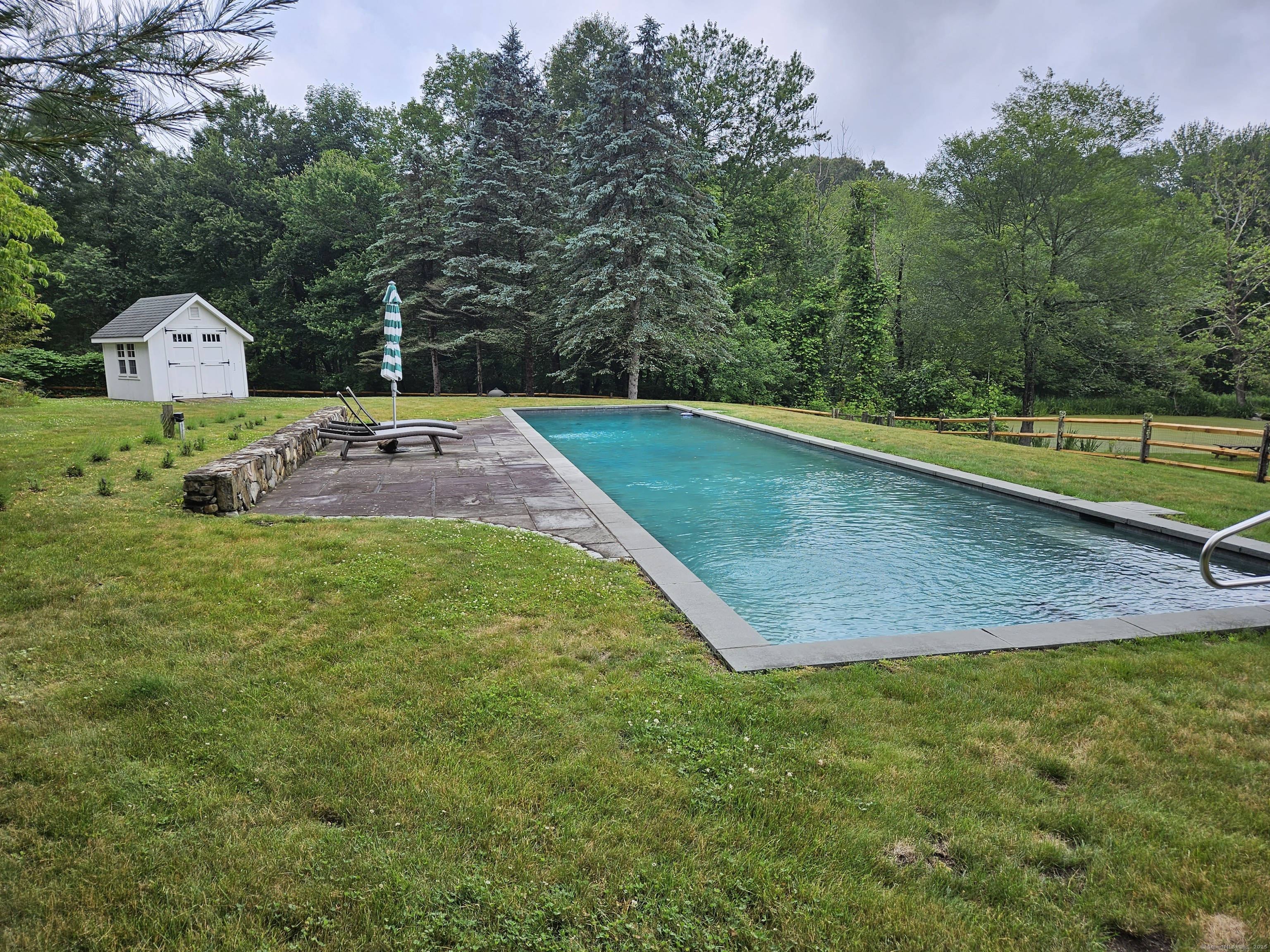 5 North Street Roxbury, CT 06783 - Photo 3 of 28 a view of a mini pool with a yard