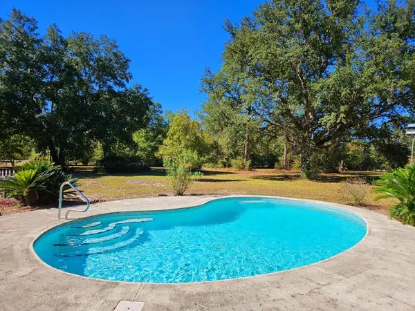 a view of a swimming pool with an outdoor space